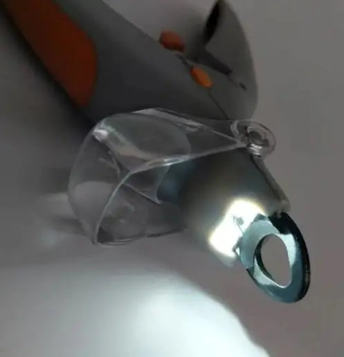 Close-up of a clear plastic component on a white background