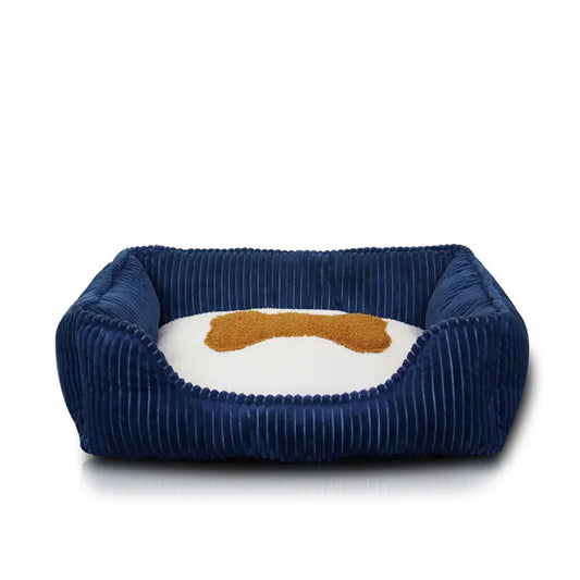 Navy blue pet bed with a white cushion and brown logo on a white background