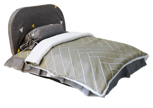 Folded bedspread with geometric pattern on a white background