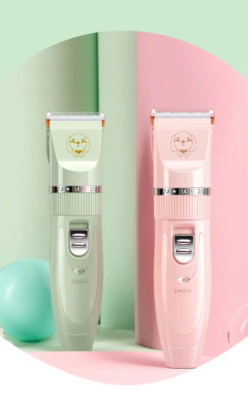 Two pet grooming clippers, one green and one pink, on a pastel background.