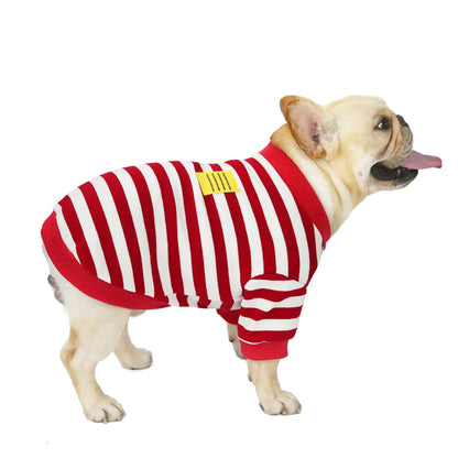 Dog wearing a red and white striped outfit on a white background