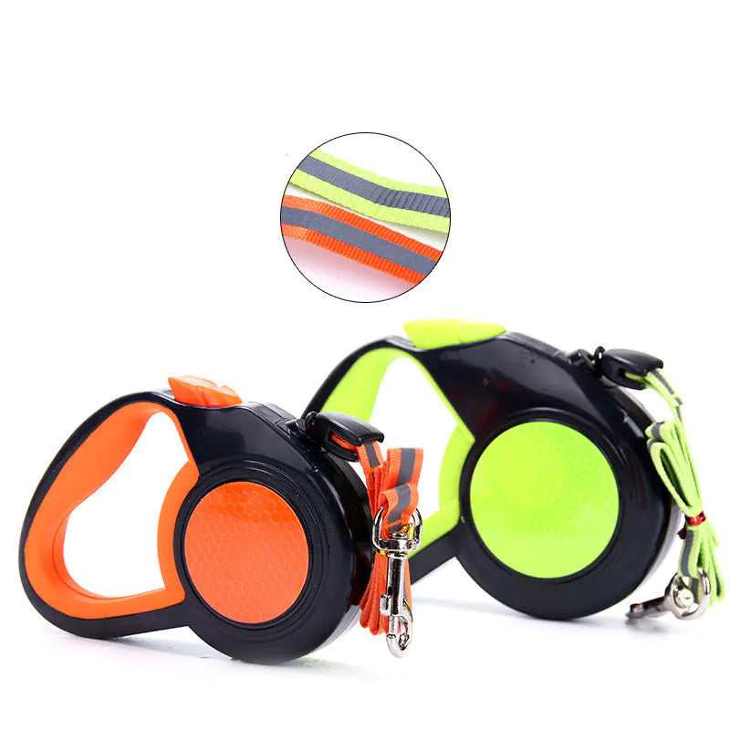 Retractable dog leashes with orange and green design on a white background