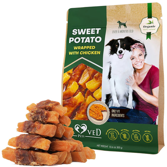Package of 'Loved Pets' sweet potato wrapped with chicken dog treats on a white background