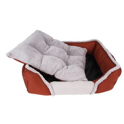 Red pet bed with gray cushion on a white background