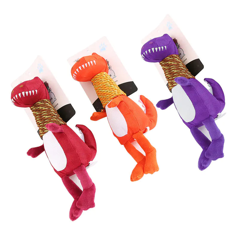 Three colorful dinosaur-shaped dog toys on white background