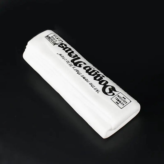 White eraser with black text on a dark background