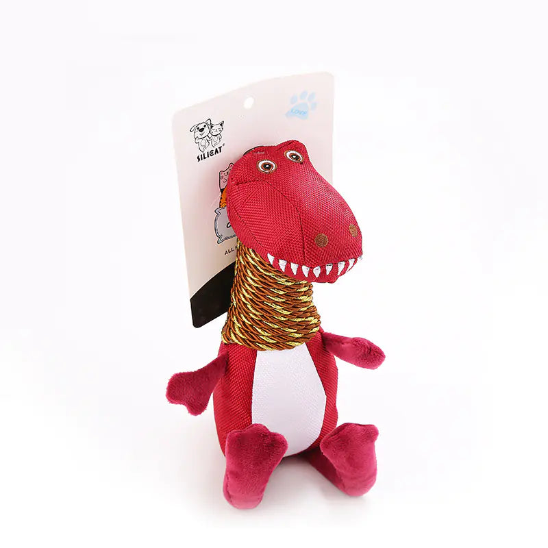 Red dinosaur-shaped toy with a gold cord on a white background