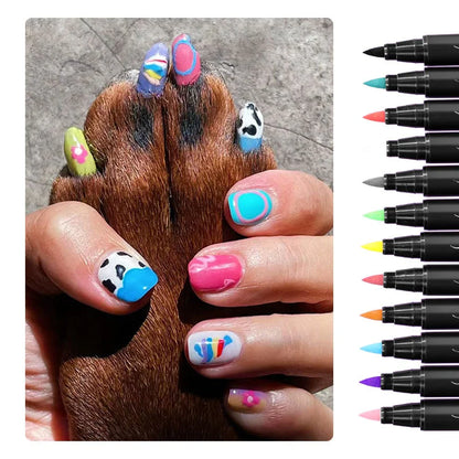 Nail art set with colorful designs on nails and a paw, alongside a set of nail art pens.