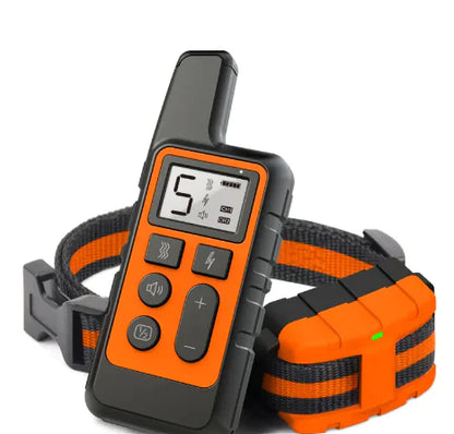 Orange and black dog training collar with remote control on a white background