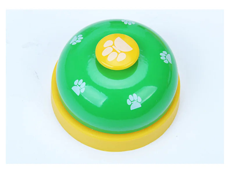 Green and yellow bell with paw prints on a light blue background