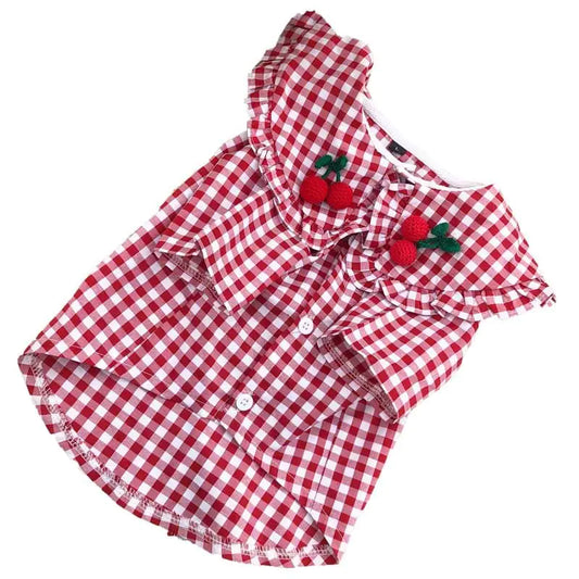 Red and white checkered dress with cherry decorations on a white background