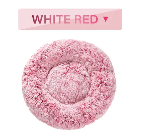 Pink fluffy pet bed with a label indicating 'White Red' on a white background