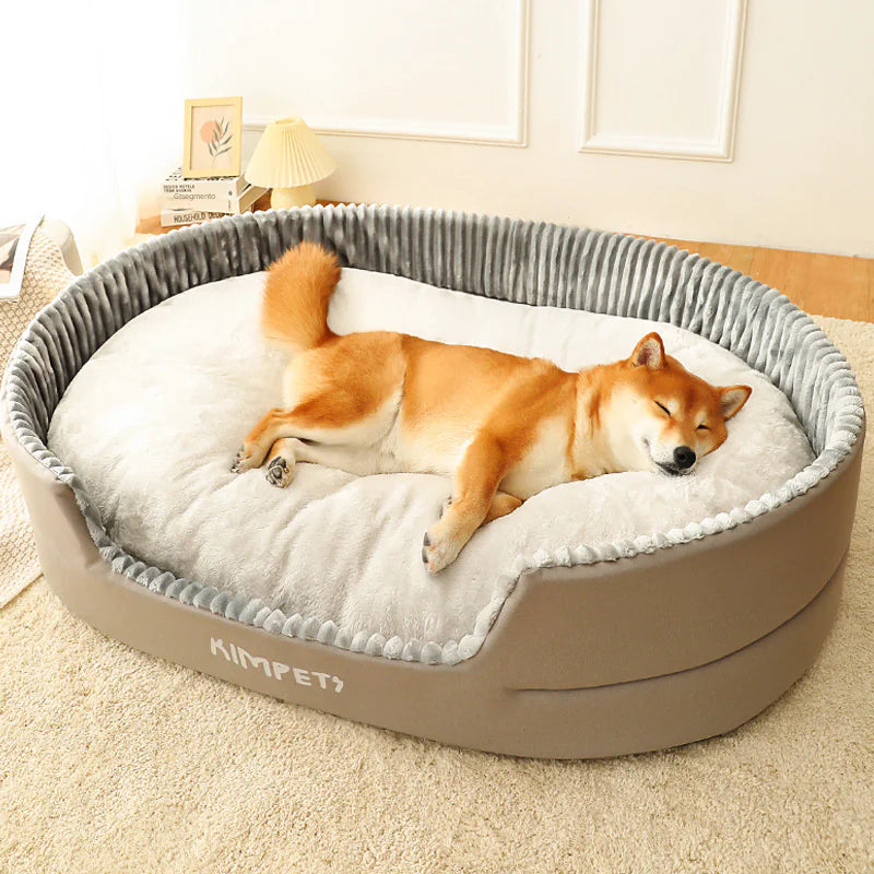 Dog lying on a KIMPET pet bed in a cozy room.