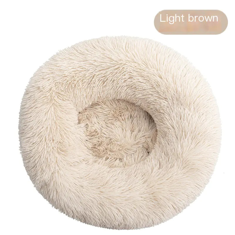 Light brown pet bed on a white background