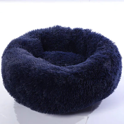 Navy blue fluffy pet bed on a white background