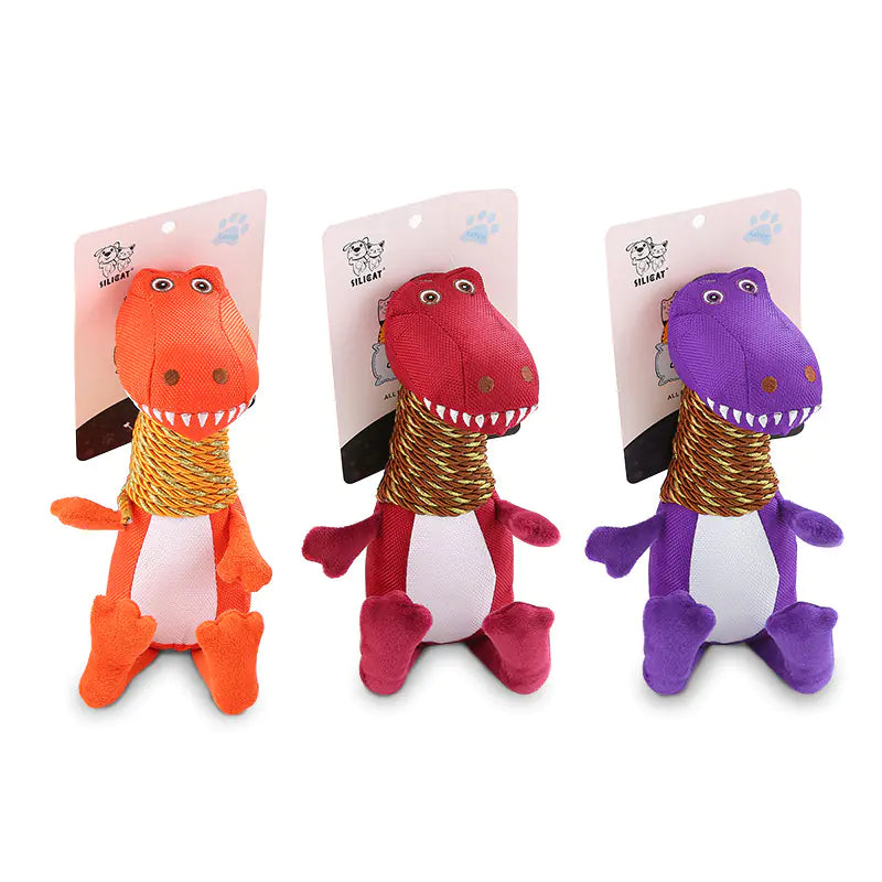 Three dinosaur-shaped toys in orange, red, and purple on white background