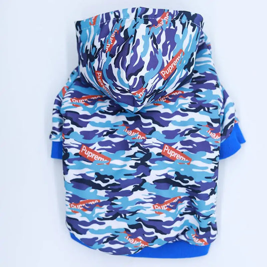 Blue and purple camouflage dog hoodie with visible branding on a white background