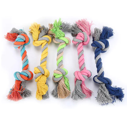 Set of colorful dog rope toys on a white background