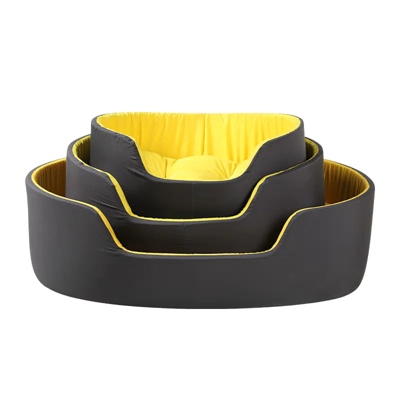 Set of three pet beds in gray with yellow interior on a white background