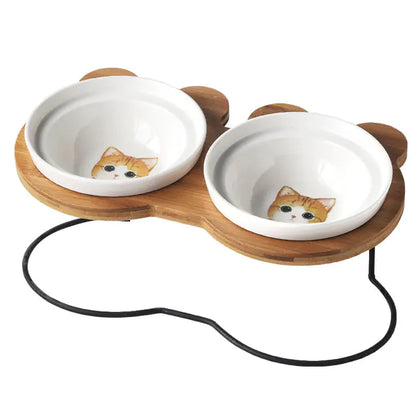 Cat food and water bowls with wooden stand on a white background