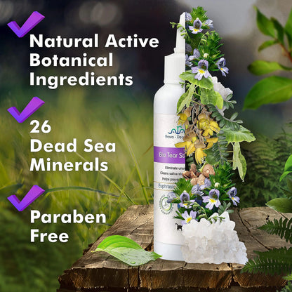 Bottle of natural skincare product with botanical elements on a wooden surface, surrounded by greenery.