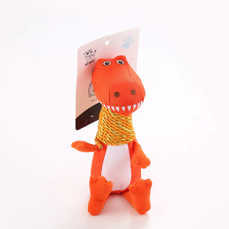Plush dinosaur toy with a packaging label on a white background