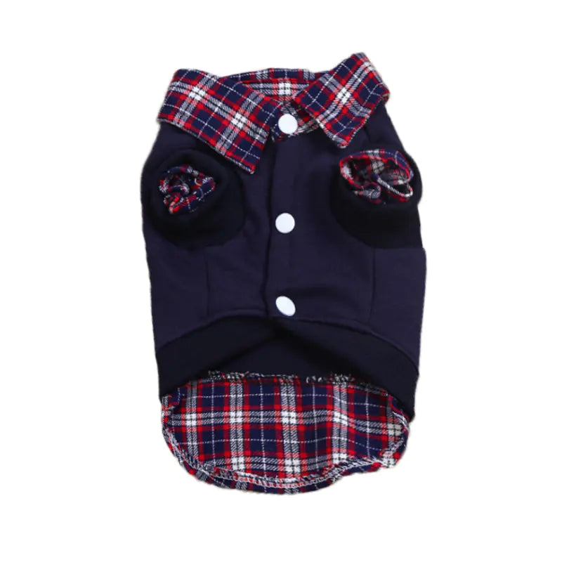 Dog wearing a plaid jacket with a red car in the background