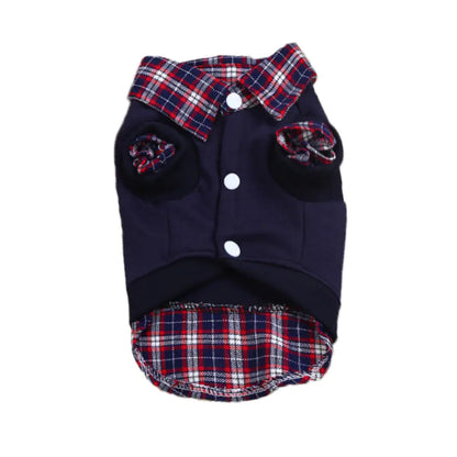 Dog wearing a plaid jacket with a red car in the background