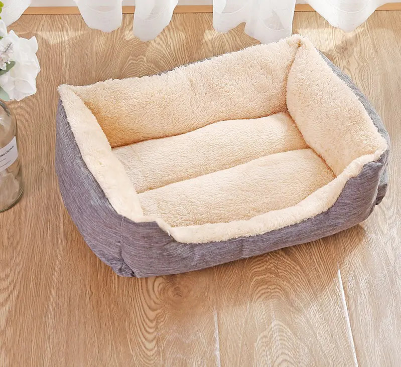 Pet bed with plush interior on a wooden floor