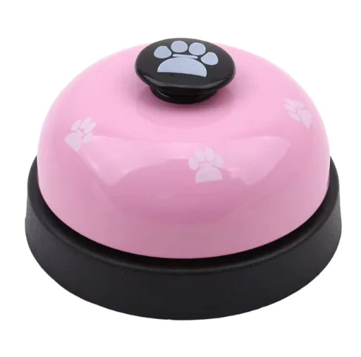 Pink bell with black base and paw print on a white background