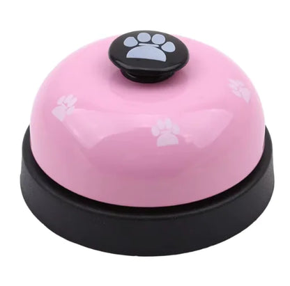 Pink bell with black base and paw print on a white background