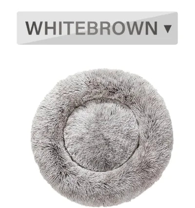Gray fluffy pet bed with a label above it displaying 'WHITEBROWN'.