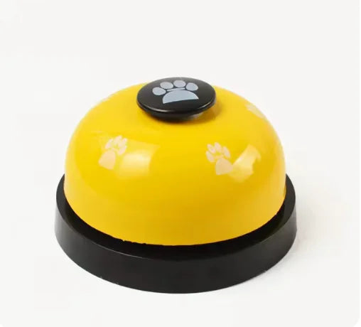 Yellow bell with paw print button on a white background