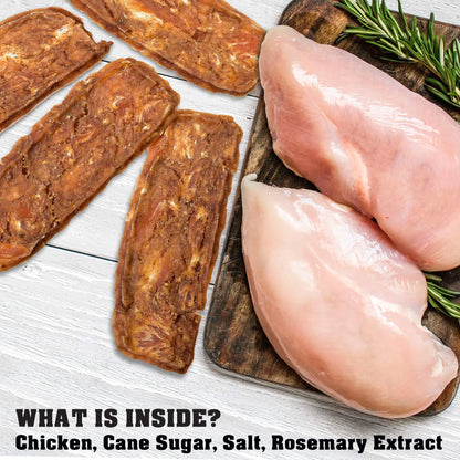 Raw chicken breasts and dried sausages on a wooden board with rosemary, on a white wooden surface.