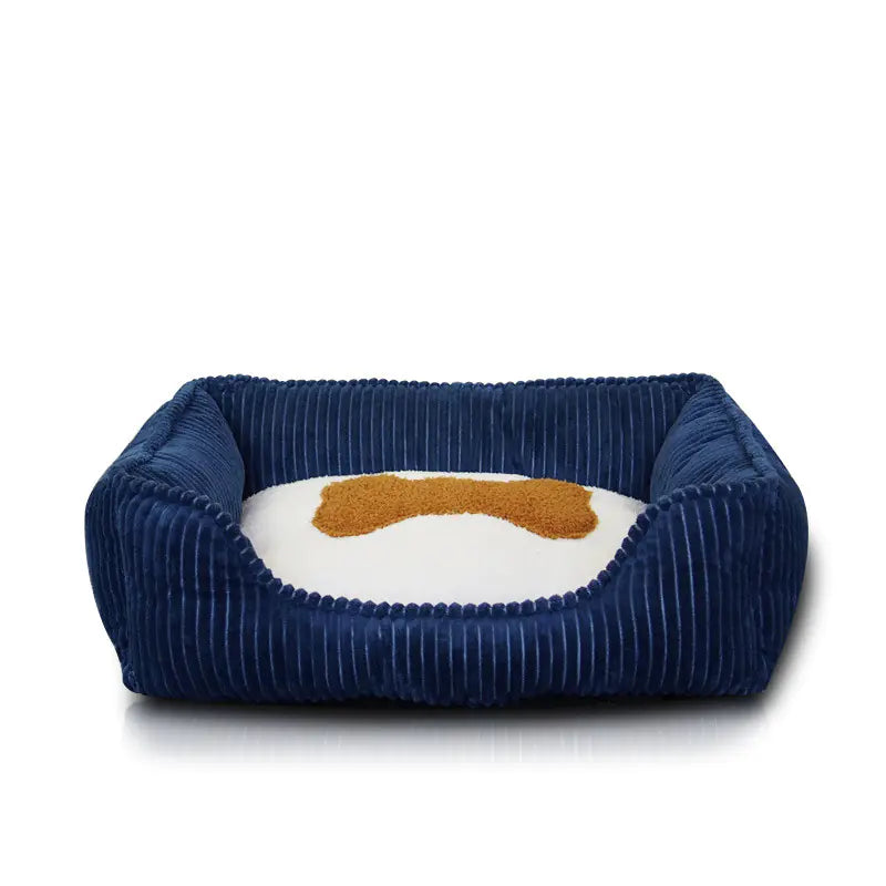 Navy blue pet bed with a white cushion and brown logo on a white background
