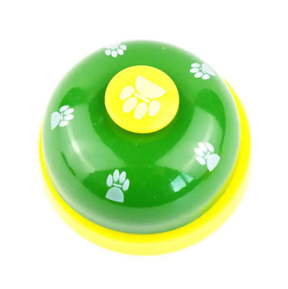 Green and yellow bell with paw prints on a white background