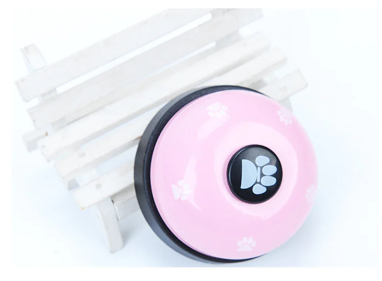 Pink round device with a paw print symbol on a white background